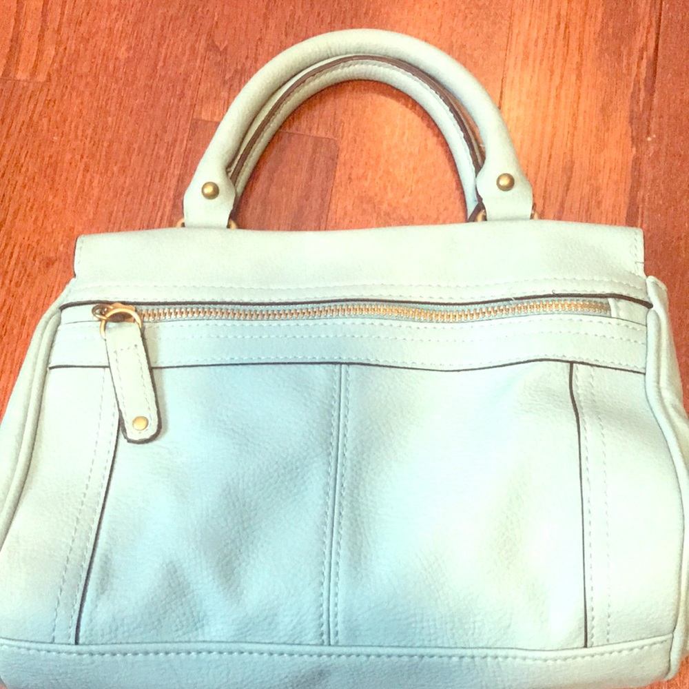 Turquoise handbag.